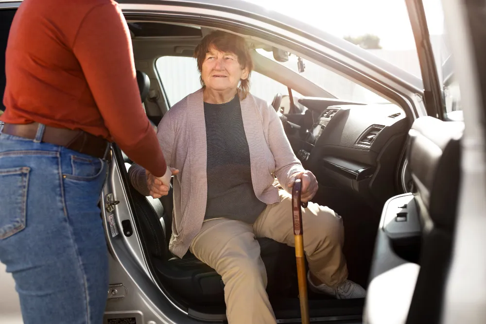 Person helping their elder neighbour.
