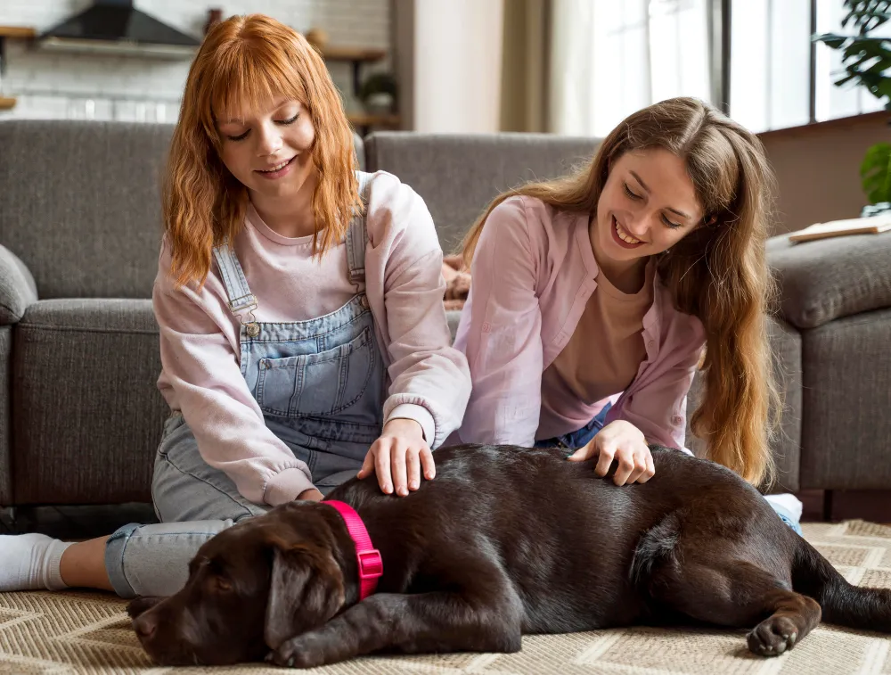 women petting dog