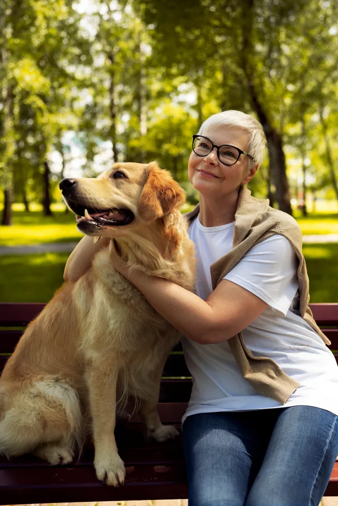 Elderly person spendng tim with their pets.