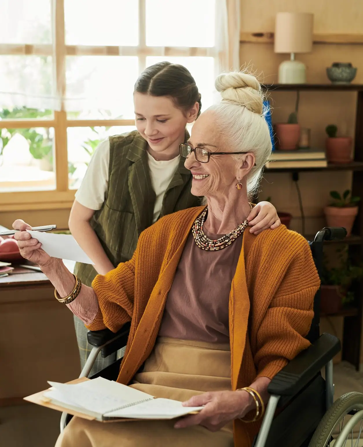a happy elderly woman with her granddaughter