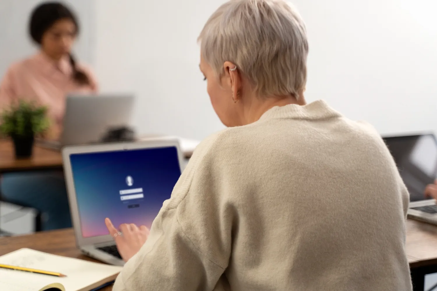 Senior people in school during class with laptop computer.