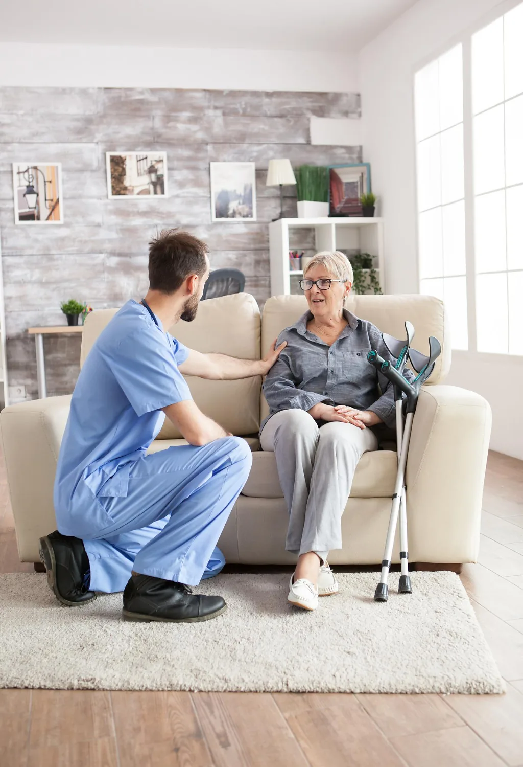 In-home care aide talking with a senior woman during a visit to her Yolo County home
