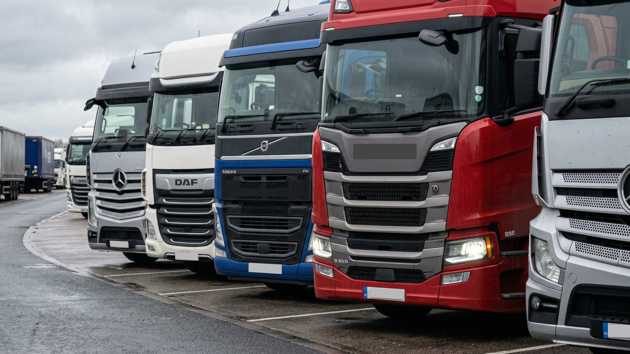 5 HGV trucks parked 