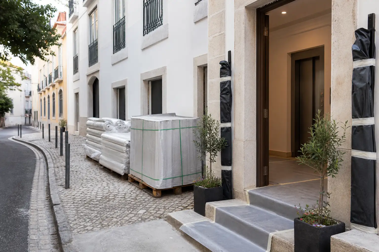 Lisbon apartment building entrance prepared for an orderly renovation-material delivery