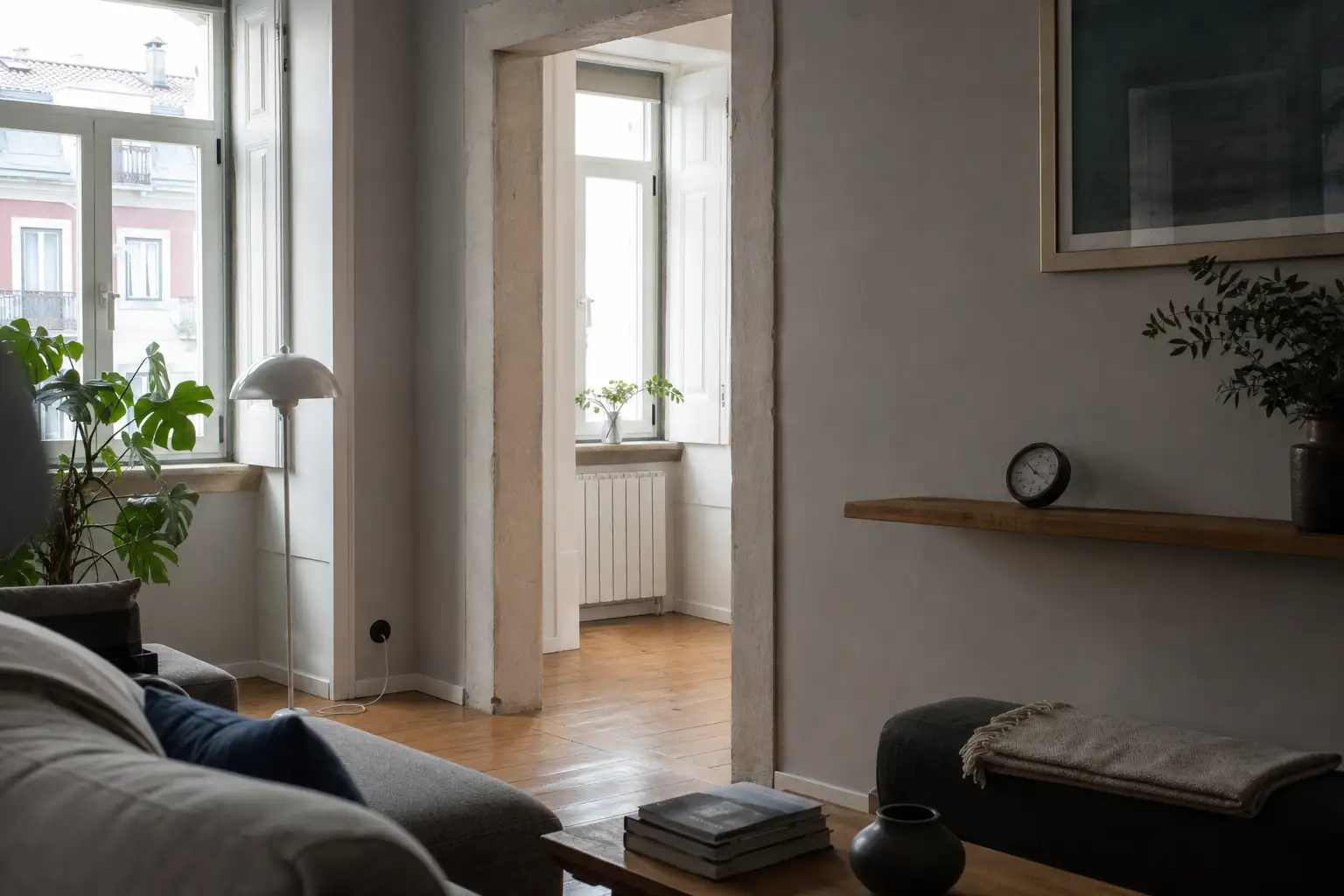 Renovated Lisbon apartment living room with insulated internal wall and natural light