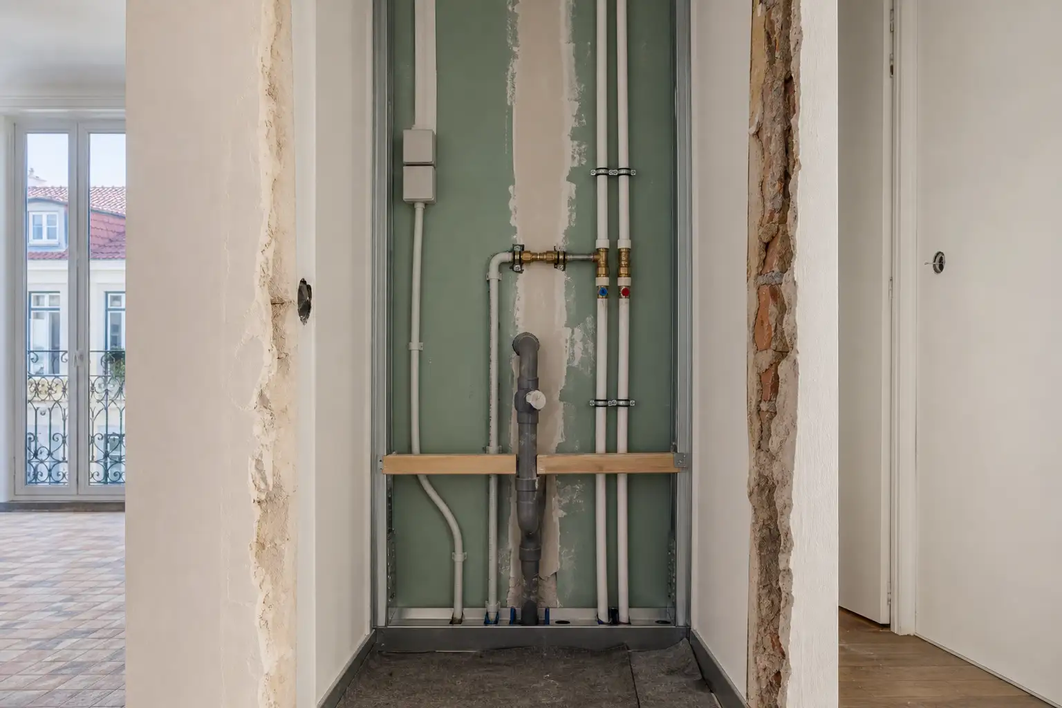Water, drainage and electrical services prepared for a laundry area during renovation