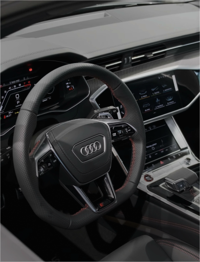 Interior view of an Audi car showcasing modern features of the dashboard and seating.