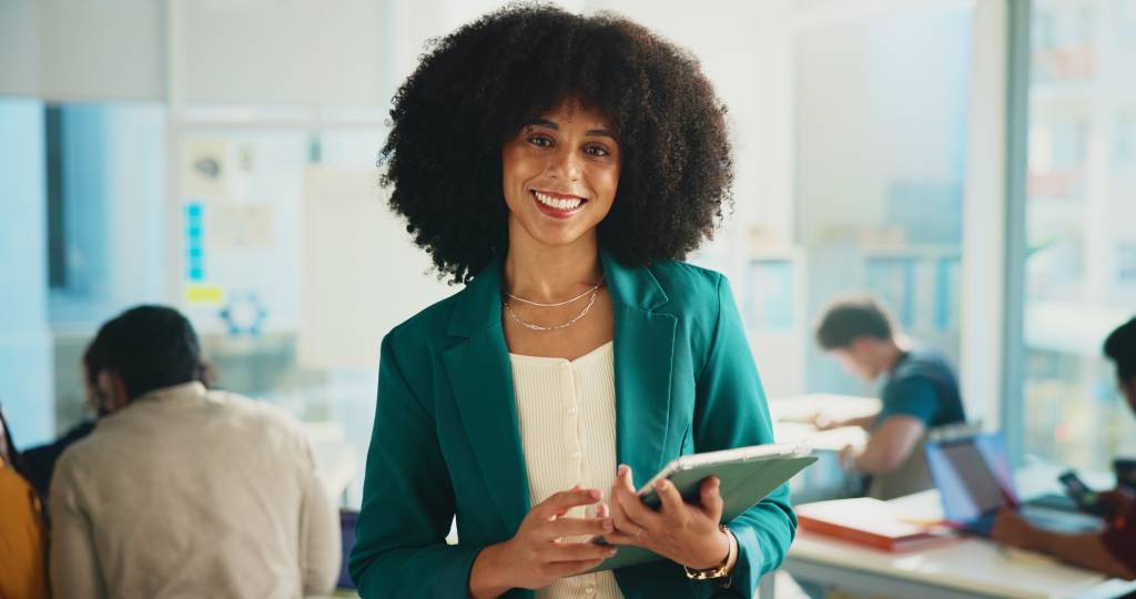 Woman in class holding tablet