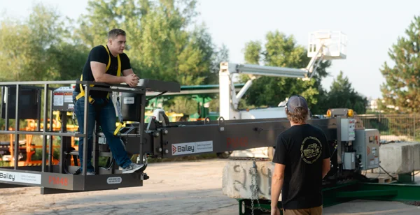 Marketing professional conversing with Industrial equipment specialist