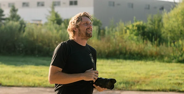 Photographer reviewing industrial equipment