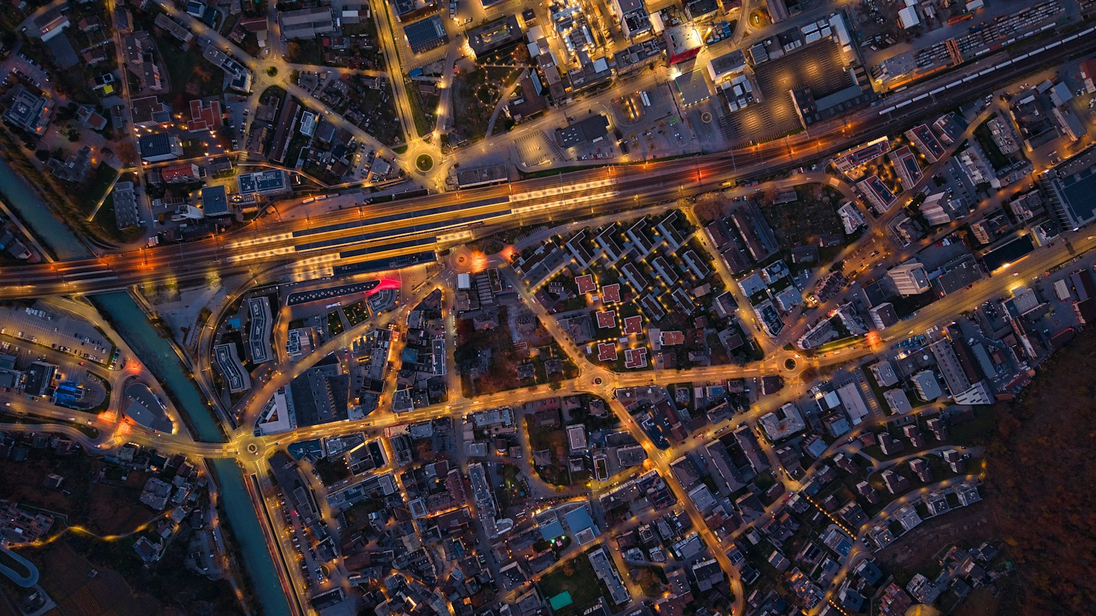 Aerial view of a city street grid lit up at night