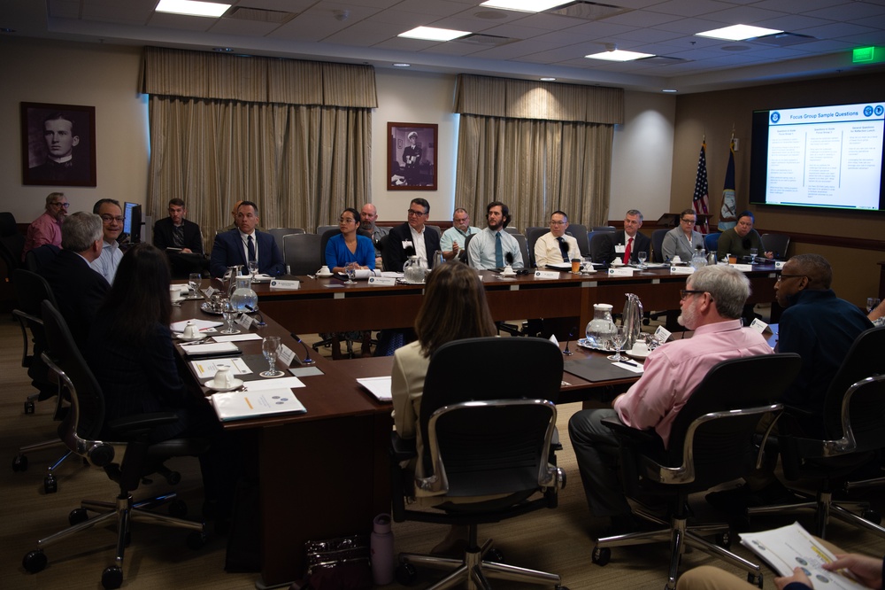 Participants in a focus group discussion around a conference table