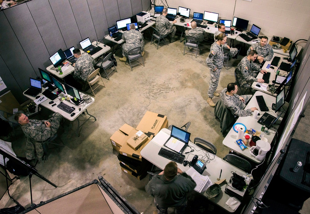 National Guard cyber team members working at computer workstations