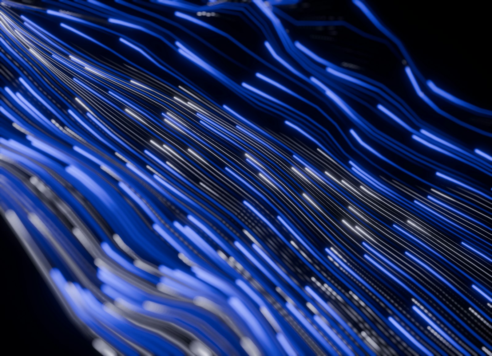 Abstract blue light streaks on a dark background