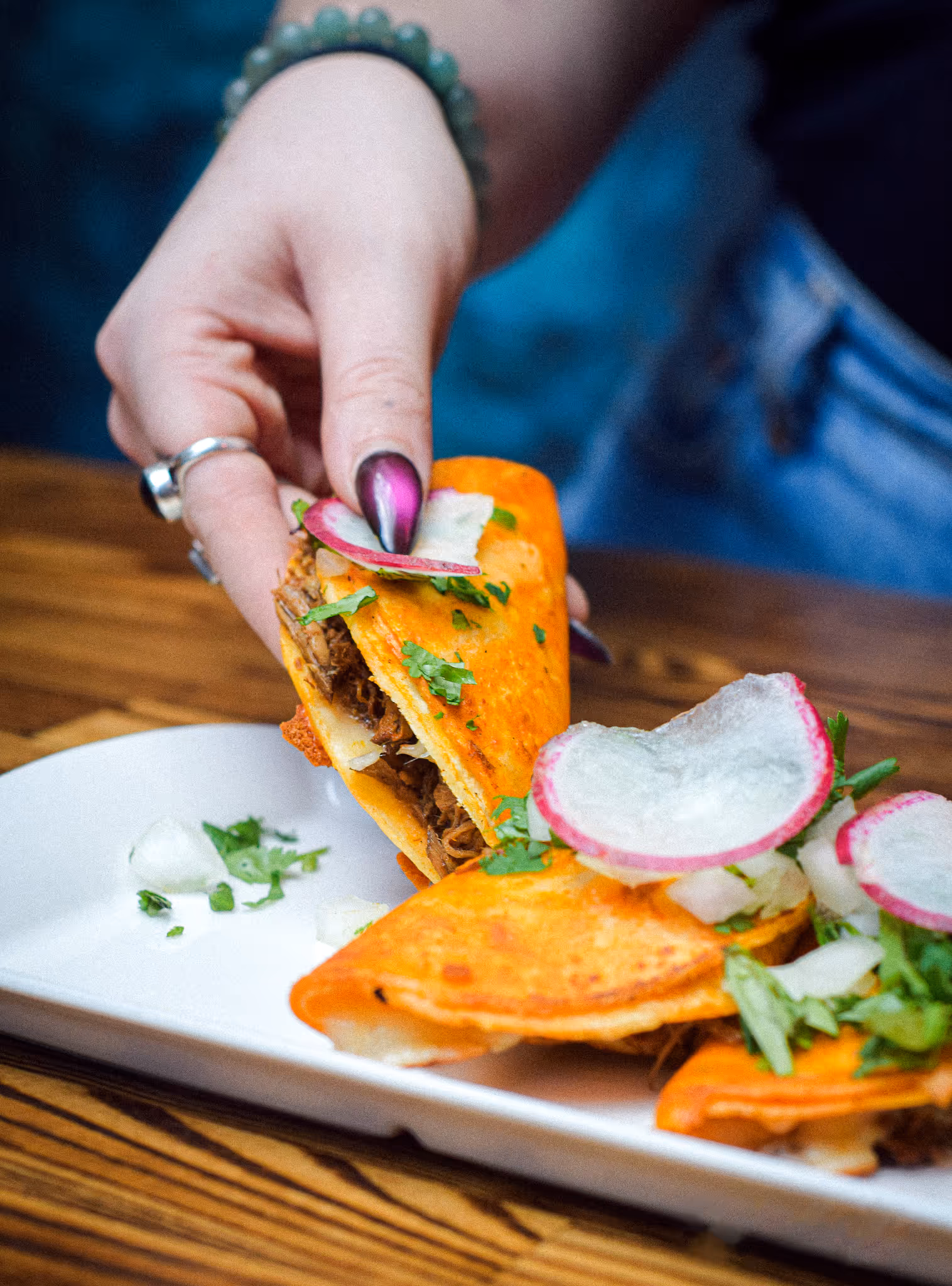 Authentic Latin cuisine,
Mexican-inspired flavors, Signature dishes, Birria Tacos