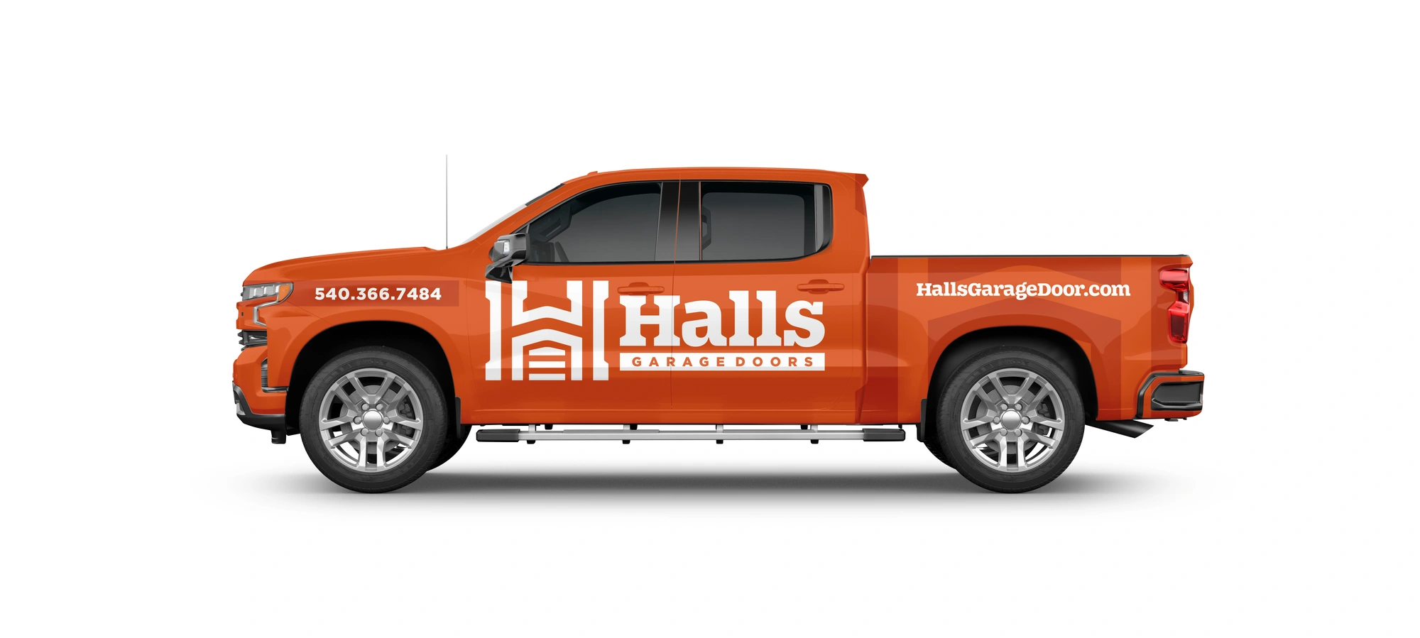 Halls Garage Doors orange pickup-wrap mockup with white logo.