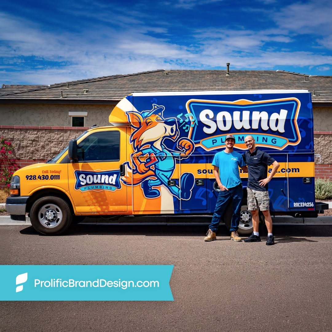 Original Sound Plumbing photograph showing the wrapped service truck with two people standing beside it.