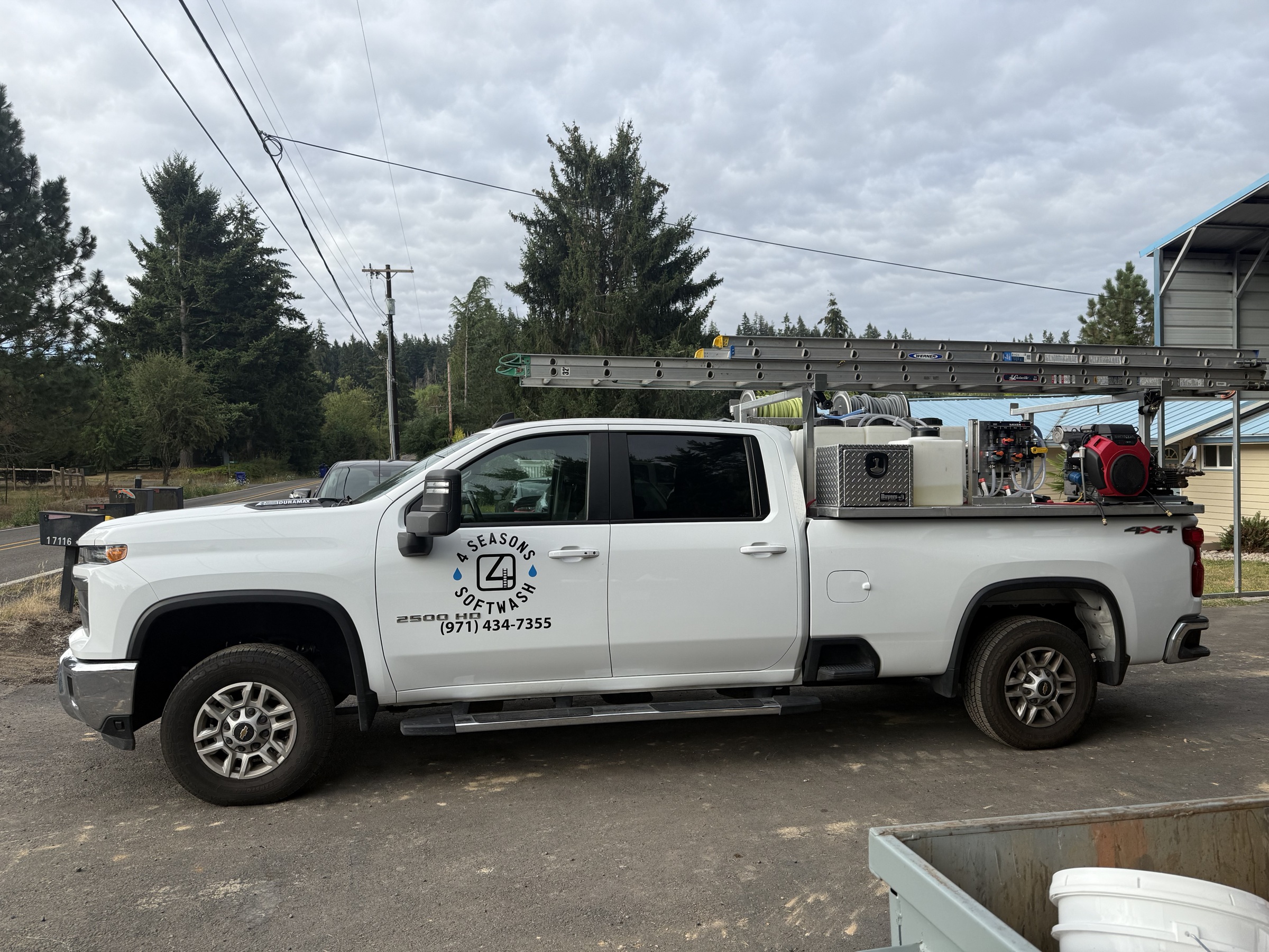Before: original Four Seasons Softwash vehicle photograph.