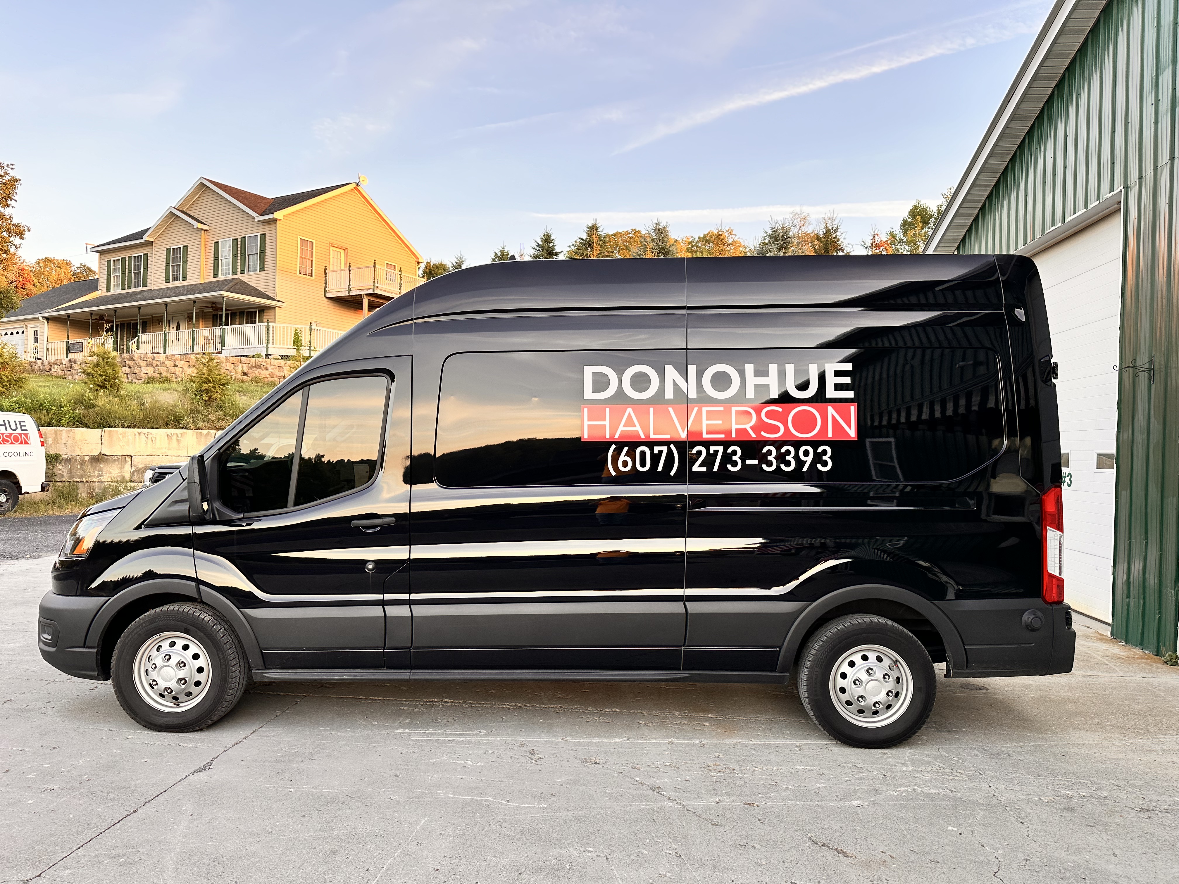 Before: original Donohue Halverson Plumbing, Heating and Cooling vehicle photograph.