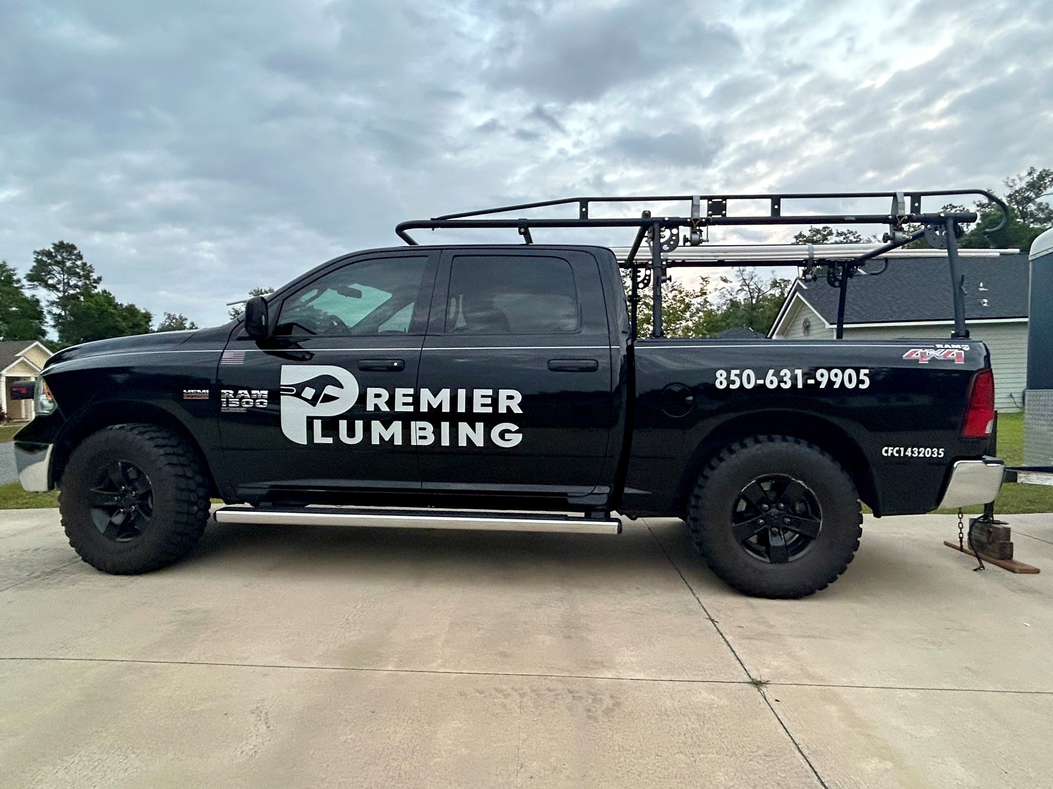 Before: Premier Plumbing vehicle photograph, the prior identity of Mariner Plumbing.