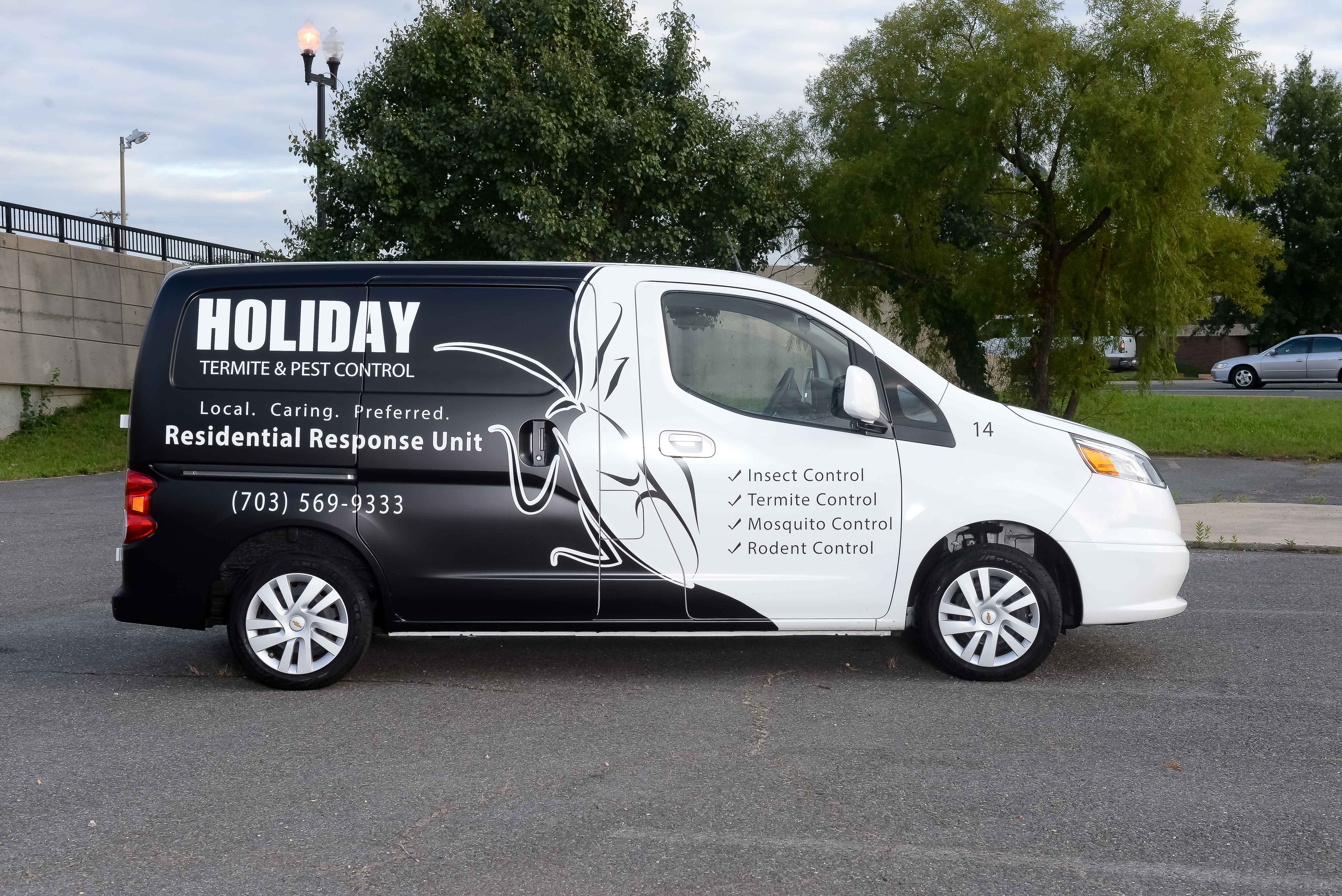 Before: original Holiday Termite & Pest Control vehicle photograph.
