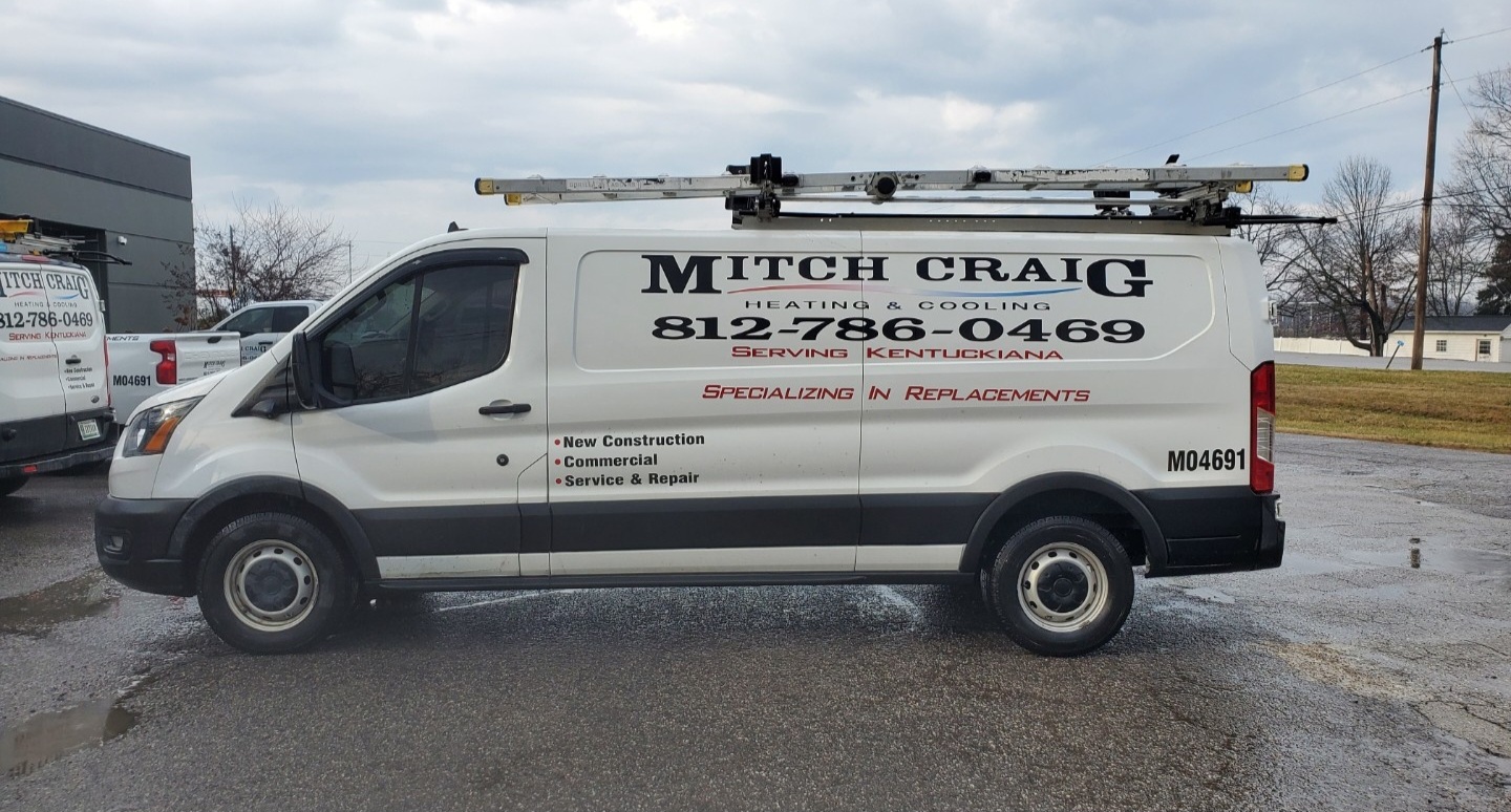 Before: original Mitch Craig Heating & Cooling vehicle photograph.