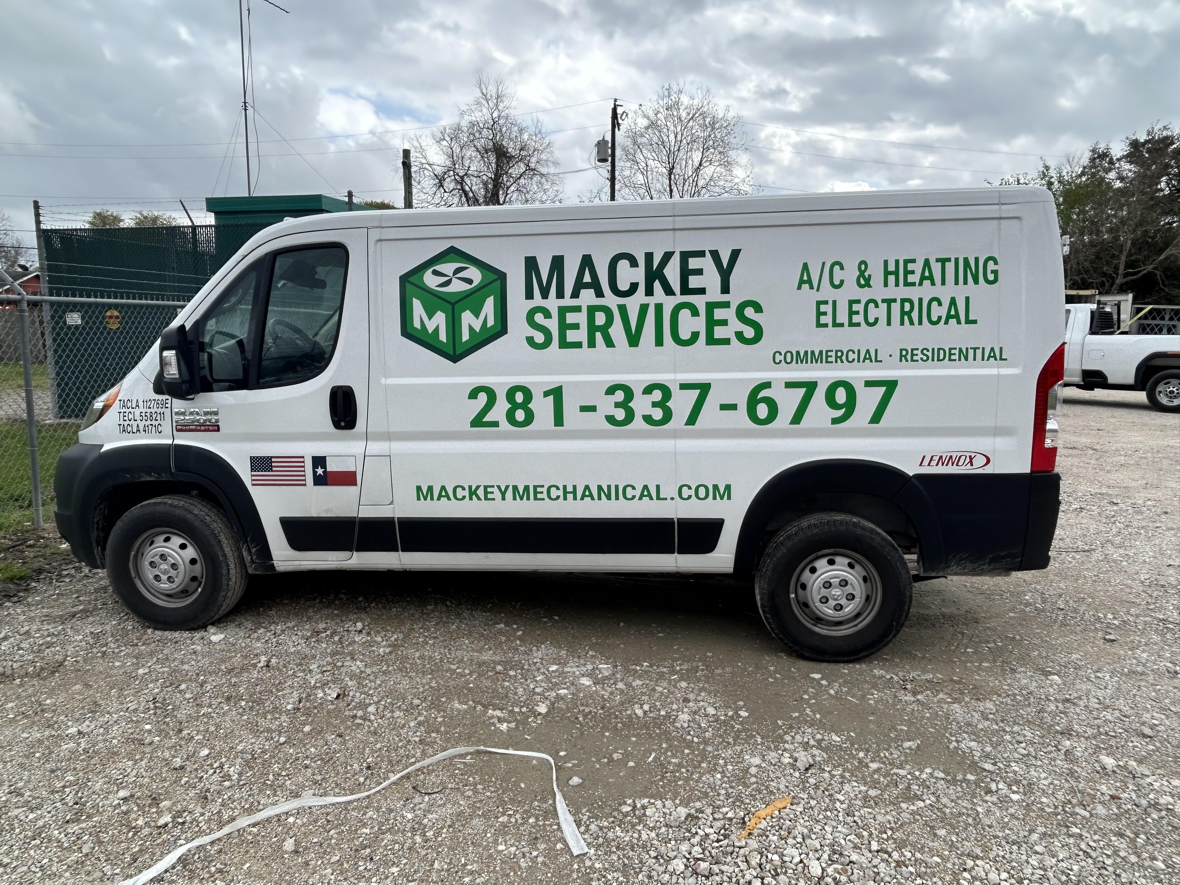 Before: original Mackey Services vehicle photograph.