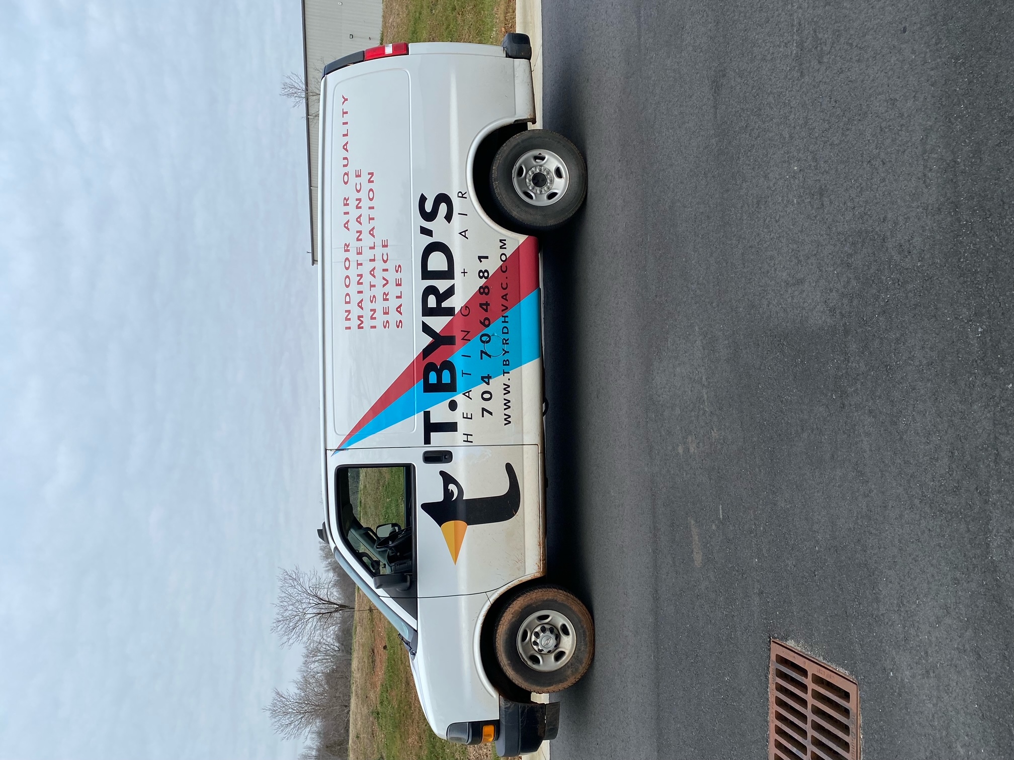 Before: original T. Byrd’s Heating & Air vehicle photograph.