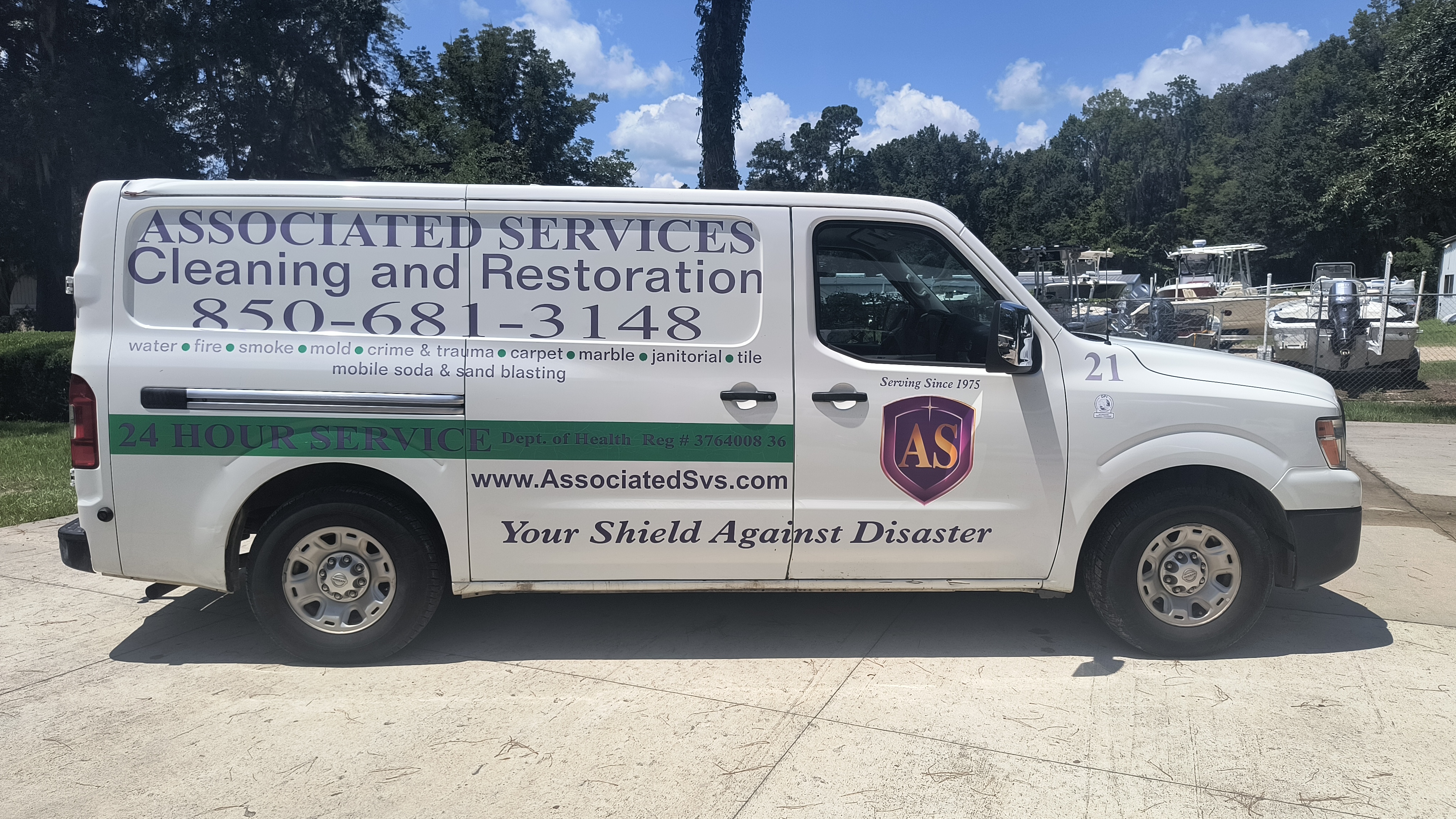 Before: Associated Services Cleaning & Restoration vehicle photograph, the prior identity of Xenos Restoration.