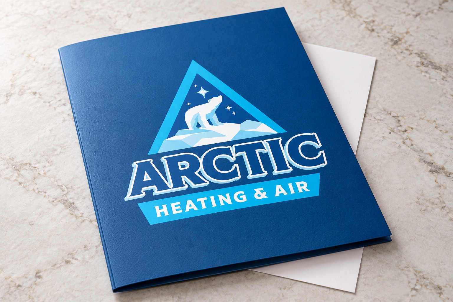 Arctic Heating & Air branded folder concept mockup.