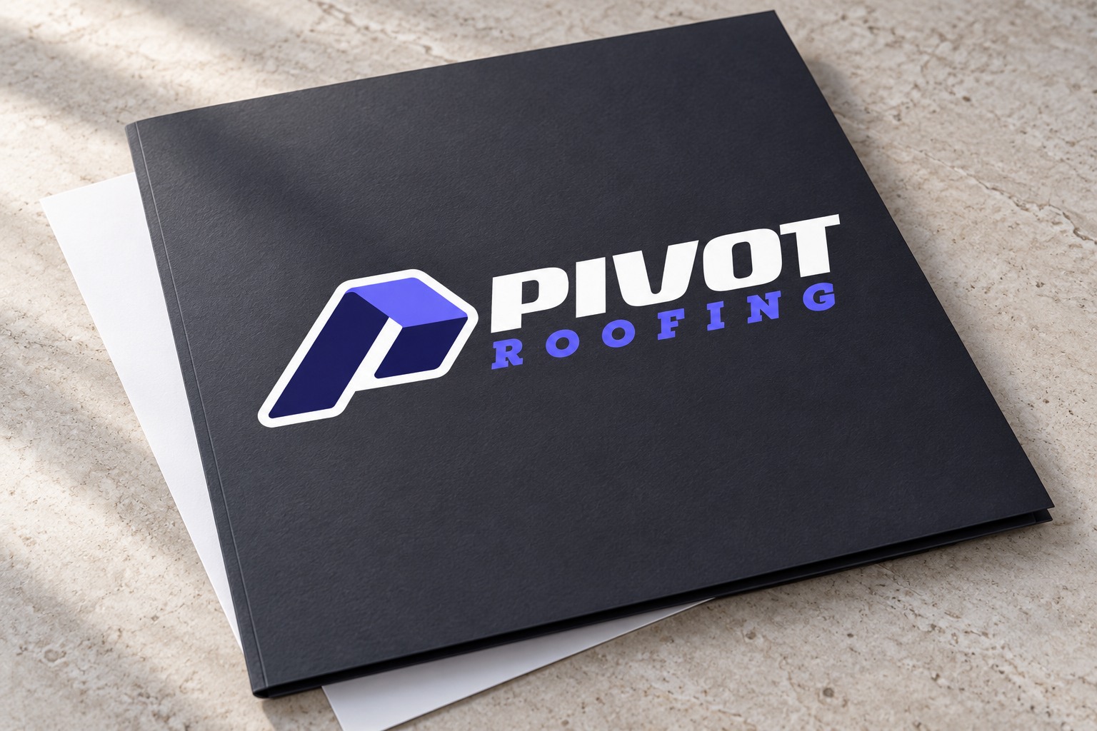 Pivot Roofing branded folder concept mockup.