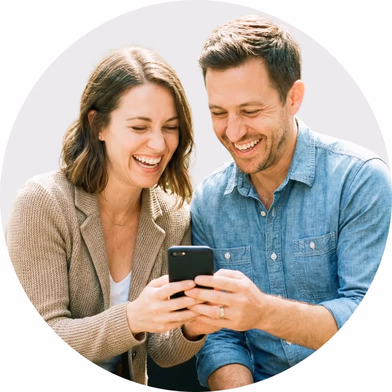 Happy couple using their budgeting software