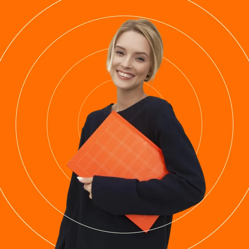 A woman holding an orange folder in front of an orange background.