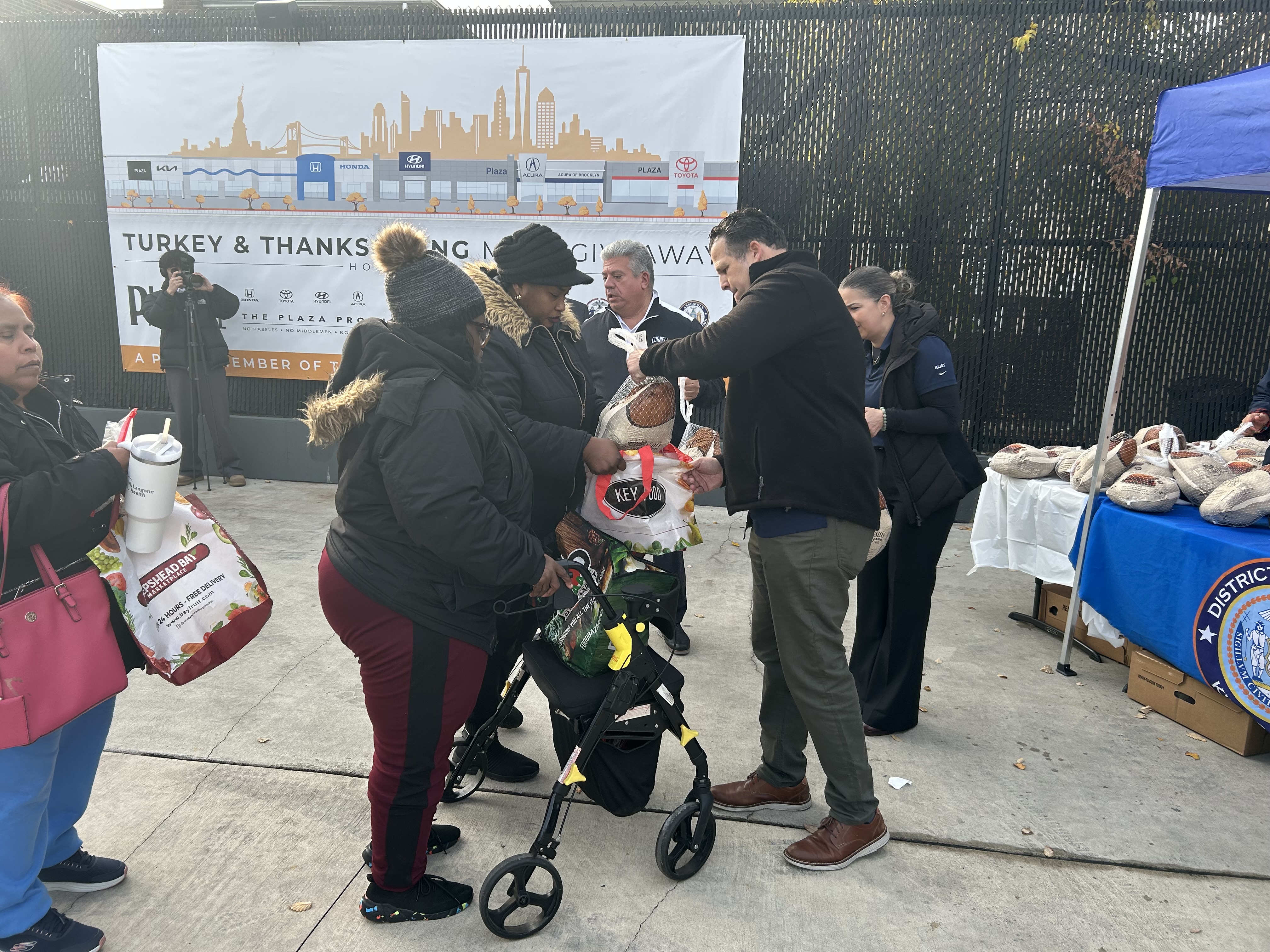 HHWA and USWU representatives with Brooklyn officials at the Thanksgiving turkey giveaway