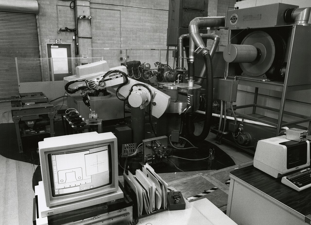 Industrial robot and computer workstations in an automated manufacturing research facility.