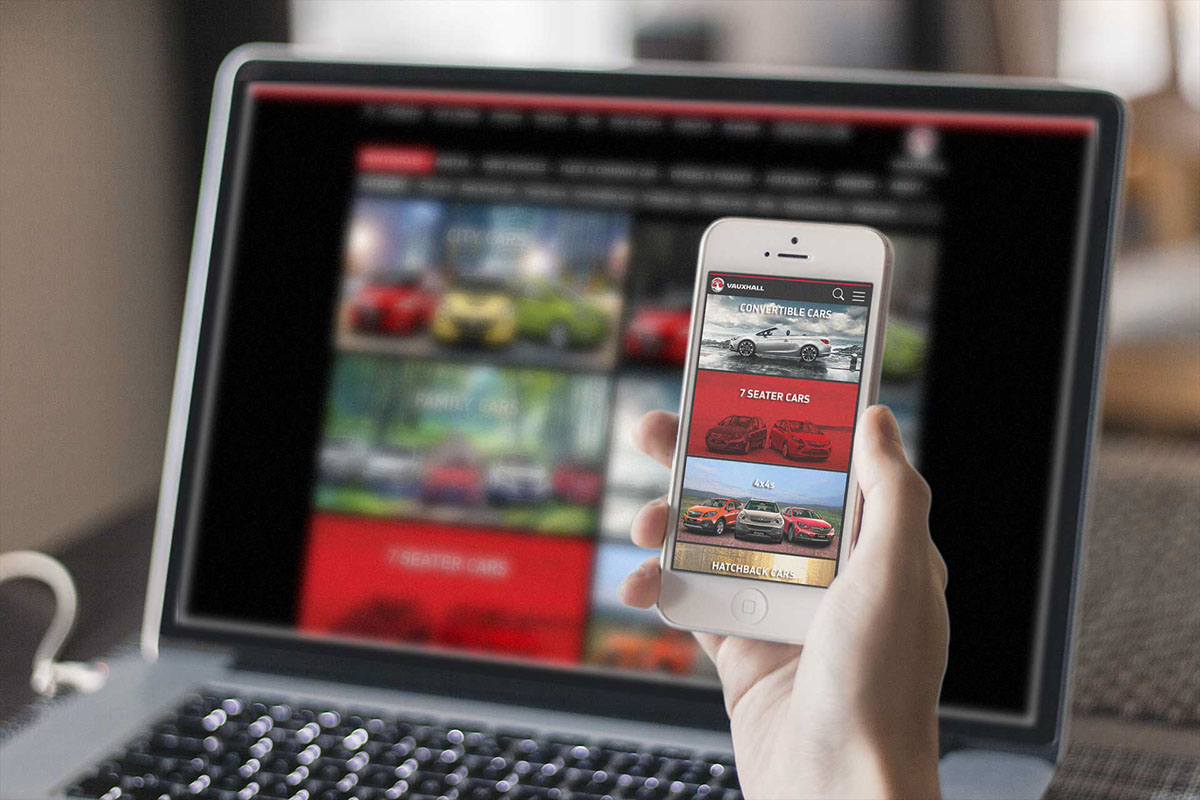 Visuals of Vauxhall's website on a laptop and mobile phone.