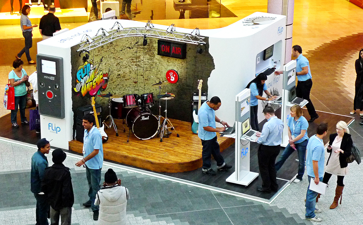 A retail display stand in a shopping centre for Flip Video.