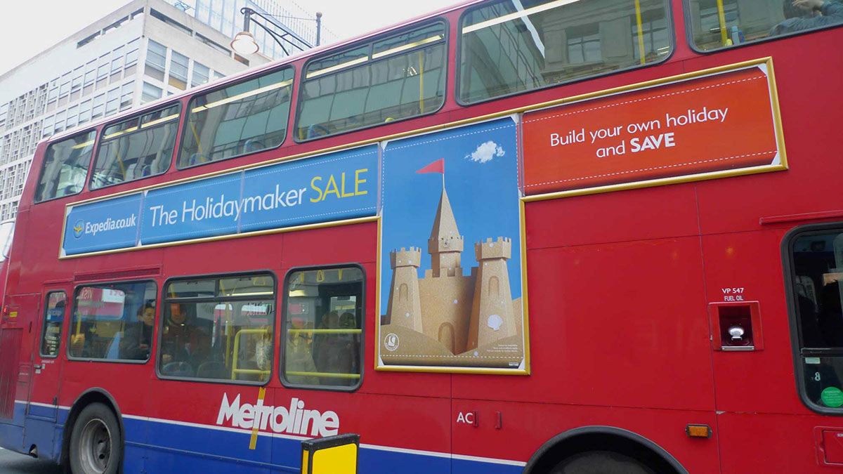 An advert on a bus side advertising the travel company Expedia.