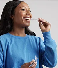 a person putting in a prosomnus sleep apnea mouthpiece appliance device