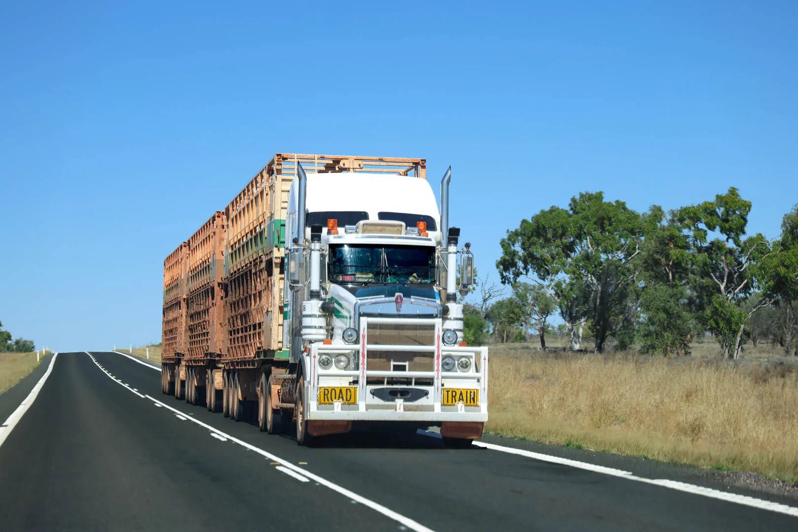 A large truck driving down an Australian road.