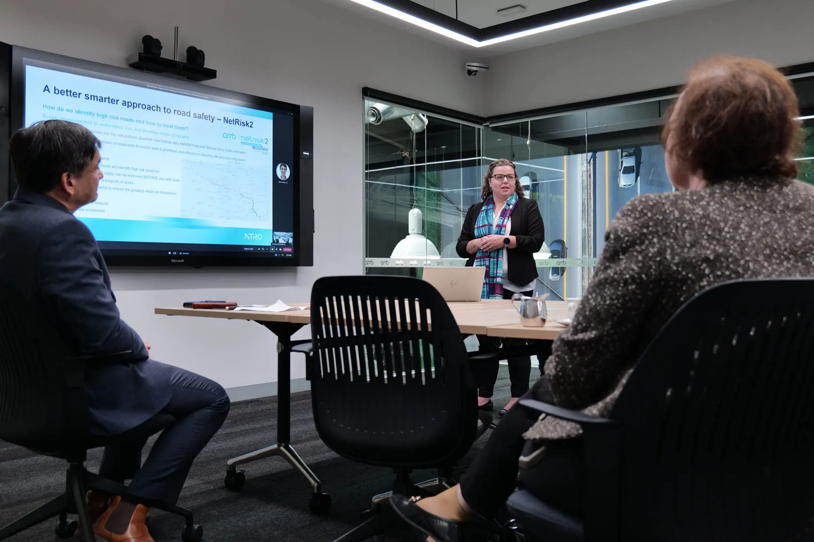 An NTRO employee giving a talk about road safety.