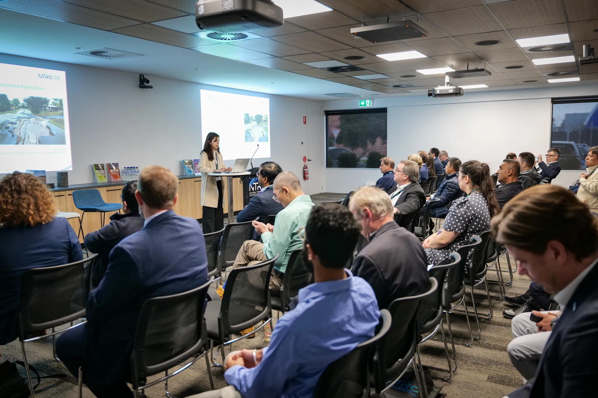 A room of people undergoing a private training session at an NTRO meeting room.