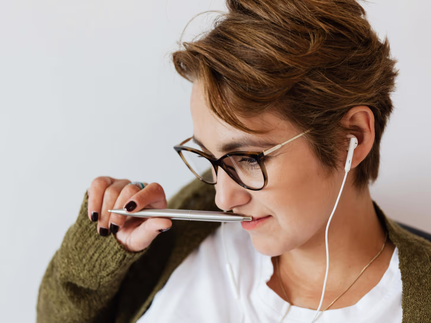 A woman listening to the podcast