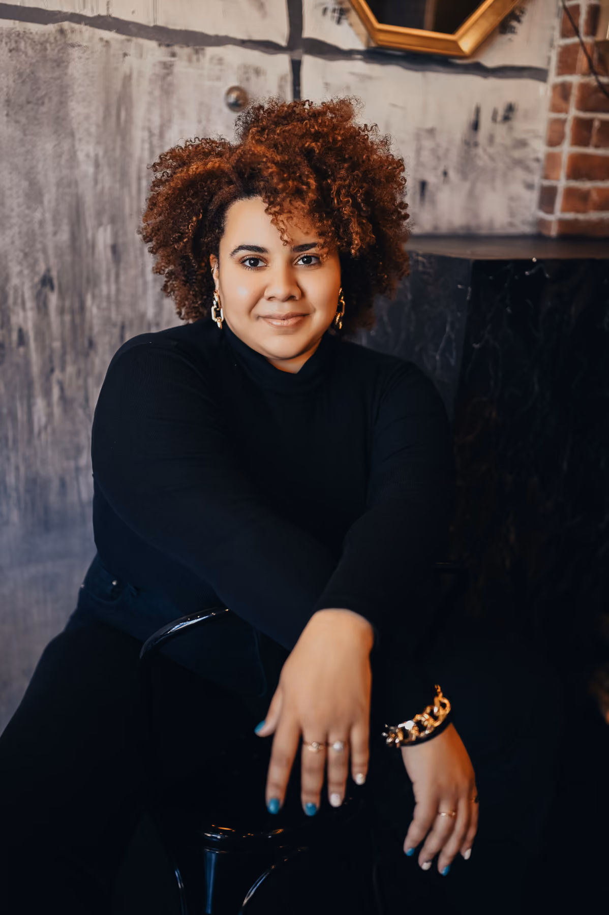 A woman sitting posing on a chair 