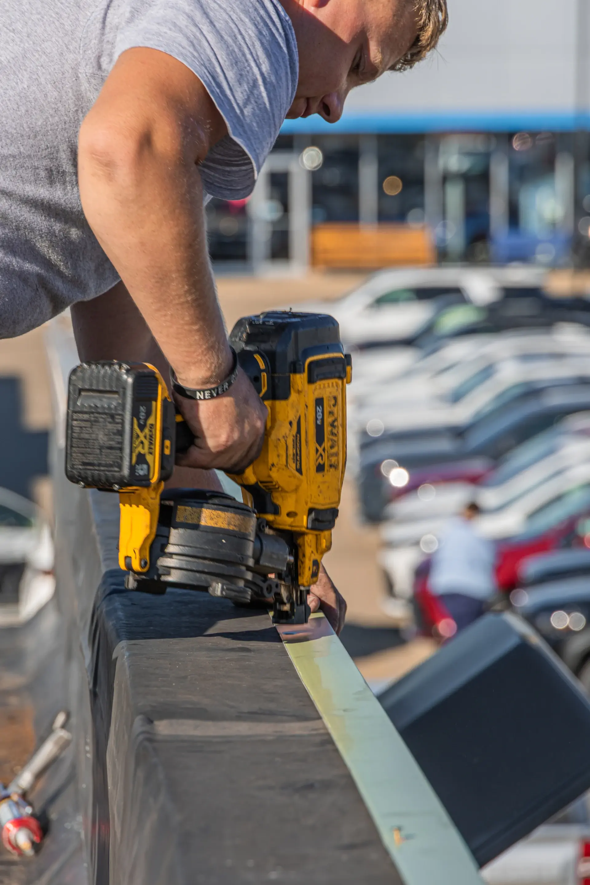 worker using a nailgun