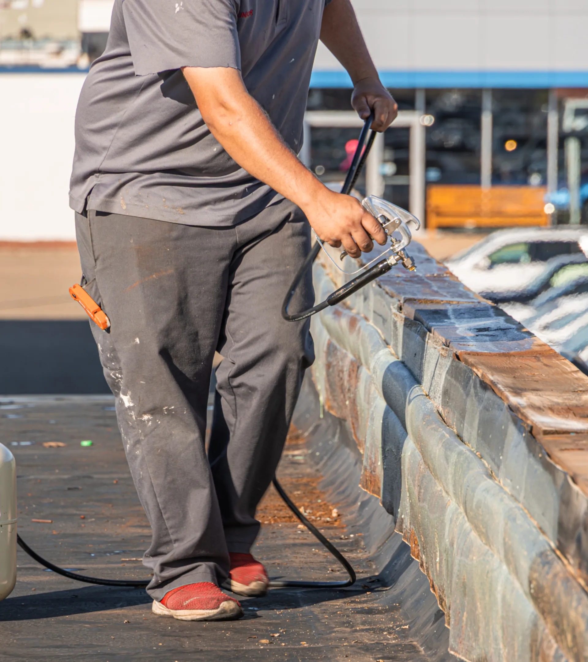 man preparing commercial roof for maintenance work