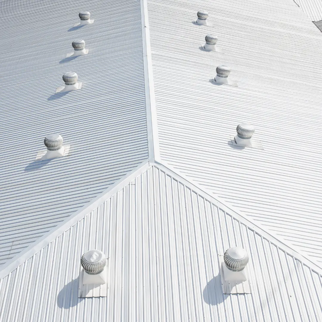sloped white metal roof on a commercial building
