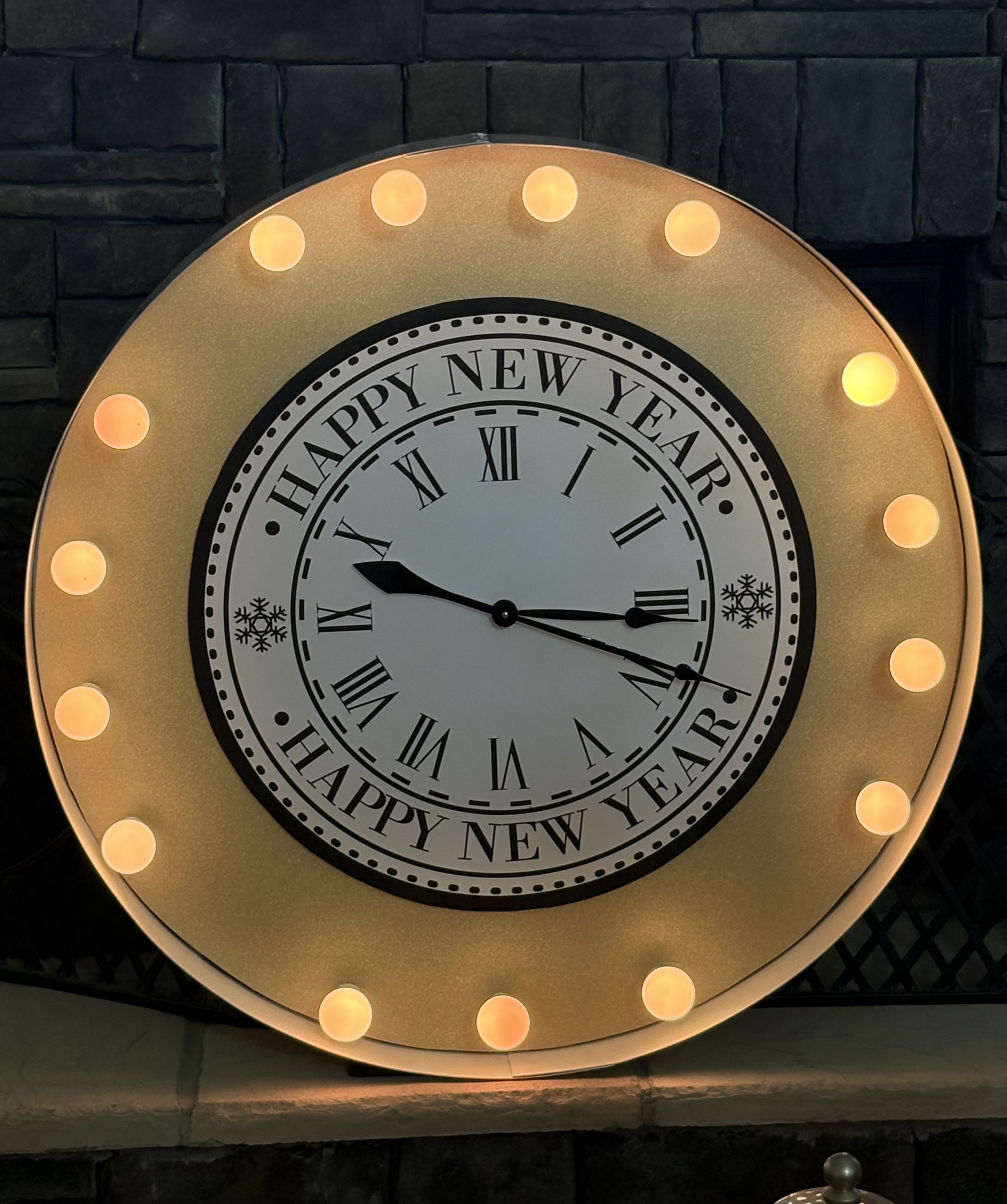 Lit letters spelling HVMS in front of silver and blue balloons at Hardin Valley Middle School with mural stars and music notes on the wall.