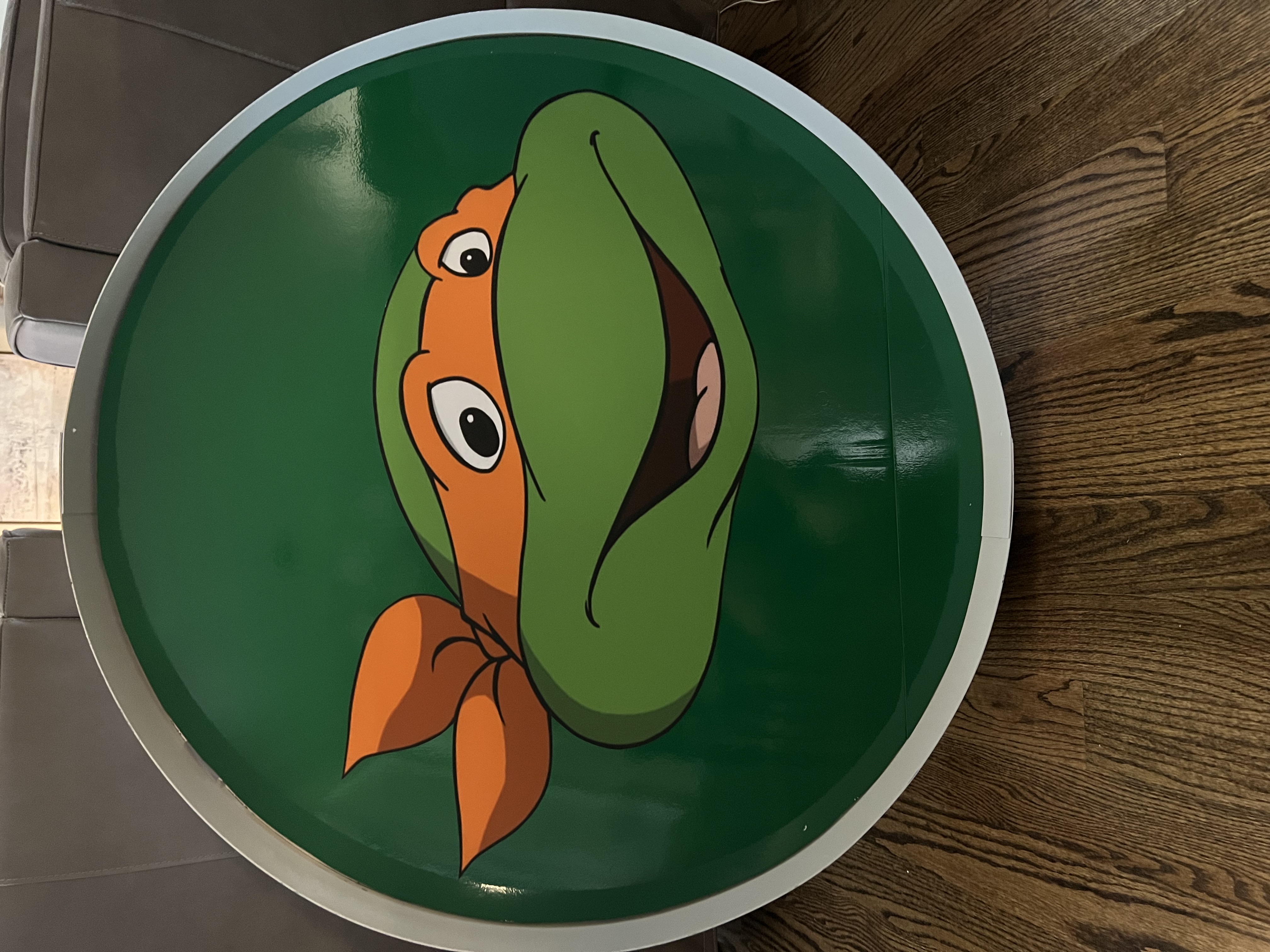 Lit letters spelling HVMS in front of silver and blue balloons at Hardin Valley Middle School with mural stars and music notes on the wall.