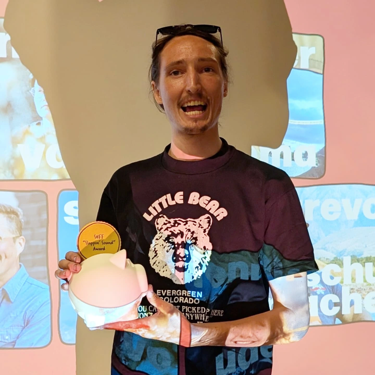 2025 Side Hustle Film Fest Slappin' Sound winner Andy Olson β holding the 3D printed coin pig award
